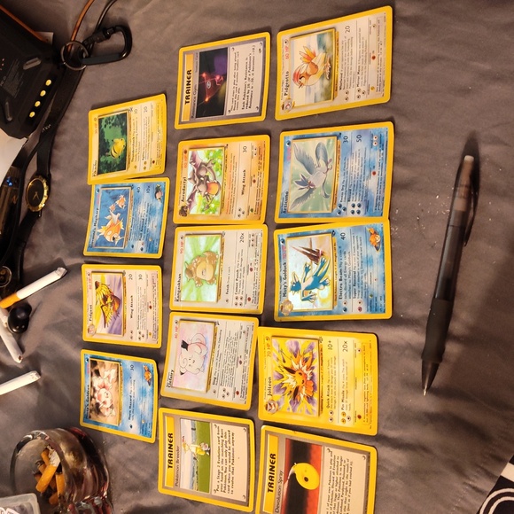 Lot of 11 first edition Pokemon cards with a black star pikachu